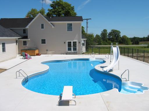 finished swimming pool in Lapeer, Mi free form vinyl liner pool shaped like a puddle oasis 